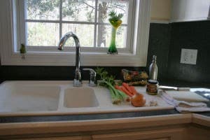 Vegetables next to kitchen sink
