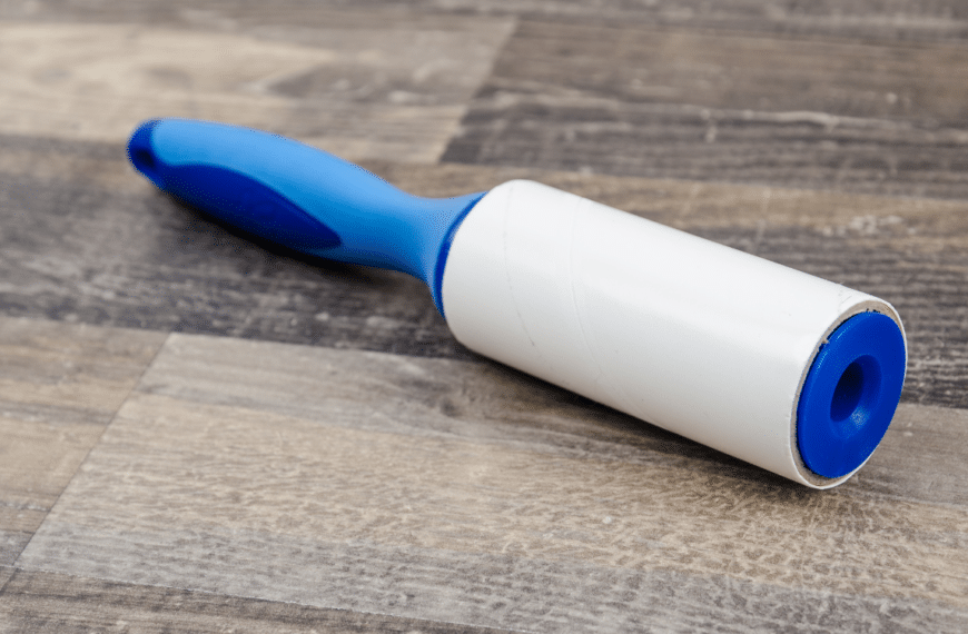 blue lint brush on wooden table