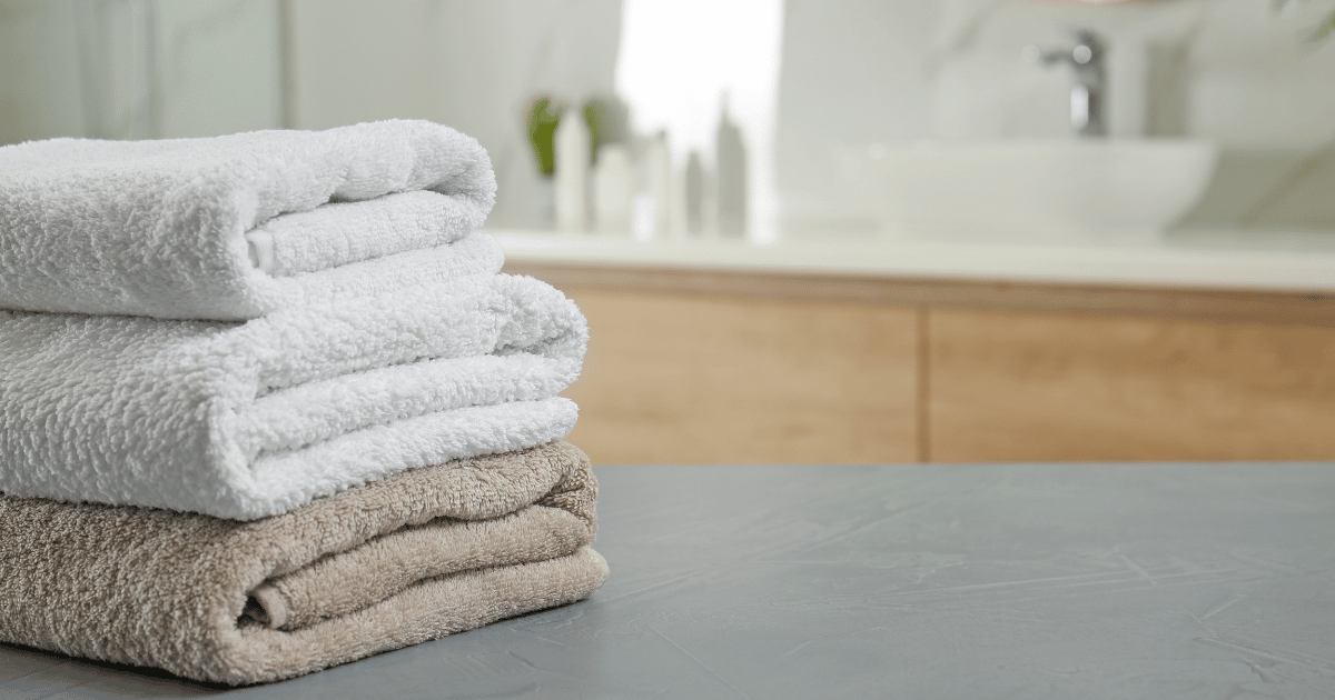 folded towels sitting on counter