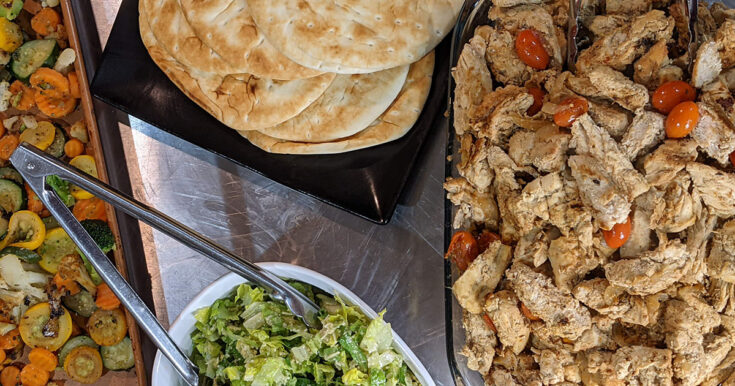 chicken, pita bread, mixed vegetables, and green salad